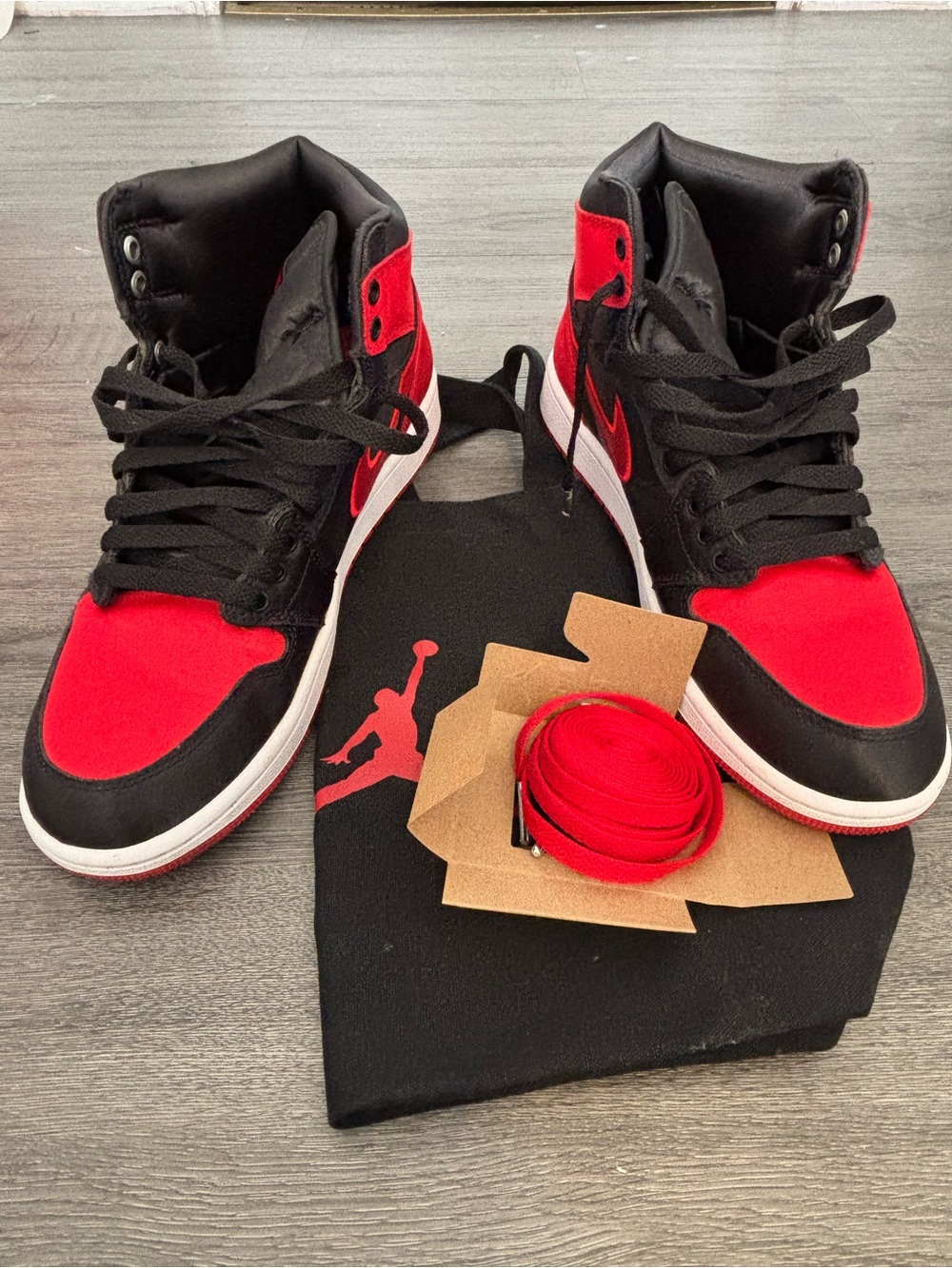 Jordan High-Top Sneakers in Black and red satin.